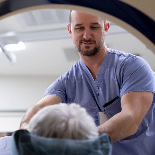 Doctor Guiding Patient through CT scan