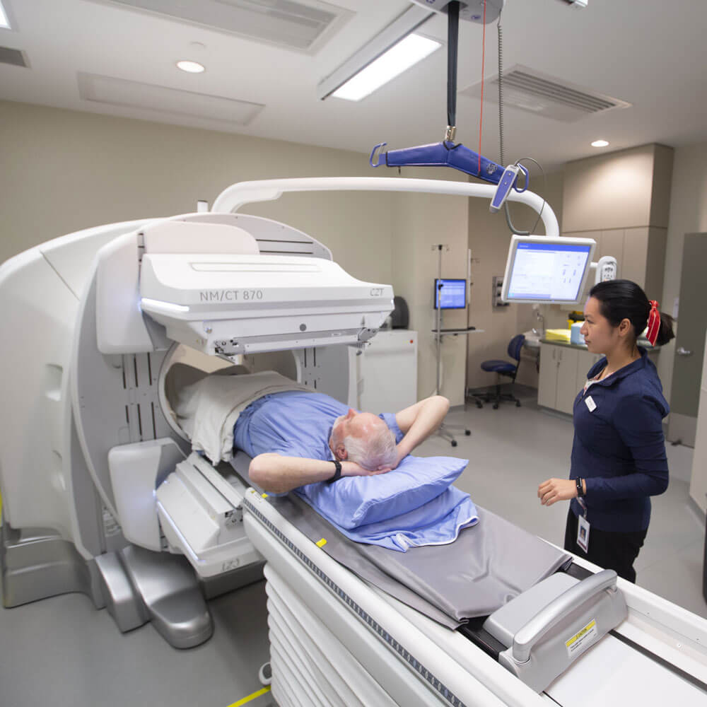 Adult man patient moving into a full body CT scan
