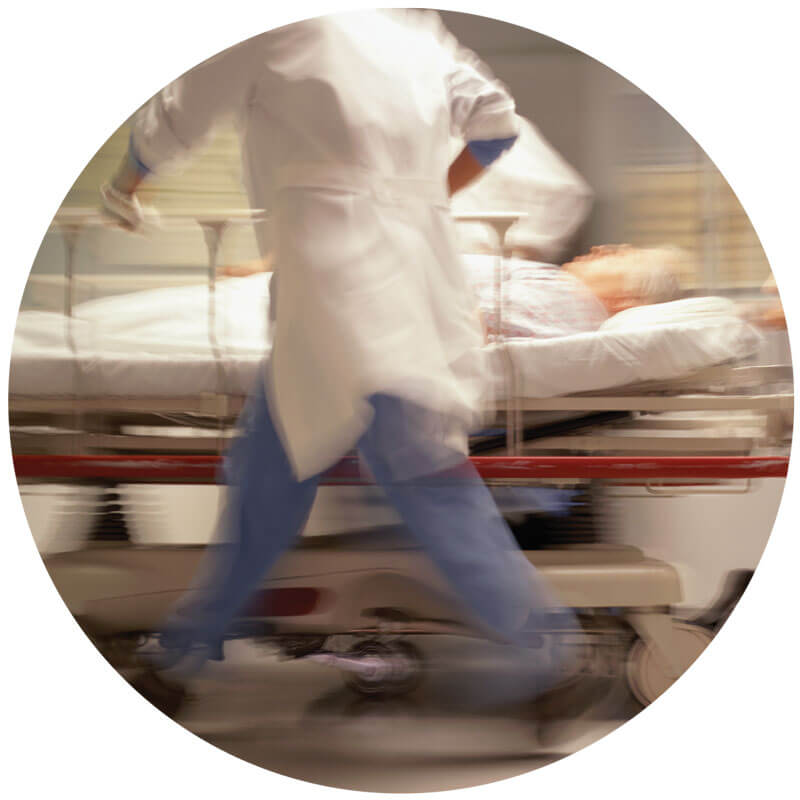 Blurred image of emergency room doctor pushing stretcher