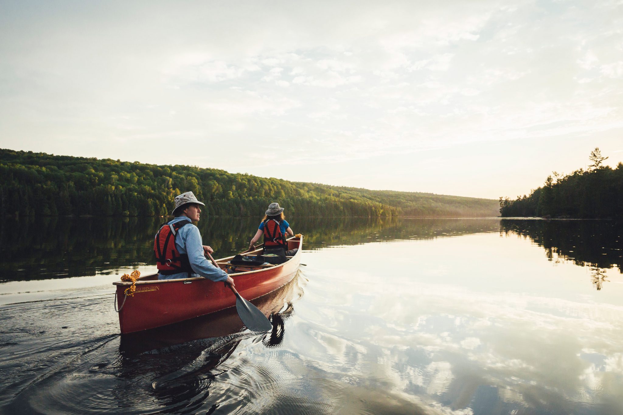 Canoe paddlers on a calm lake