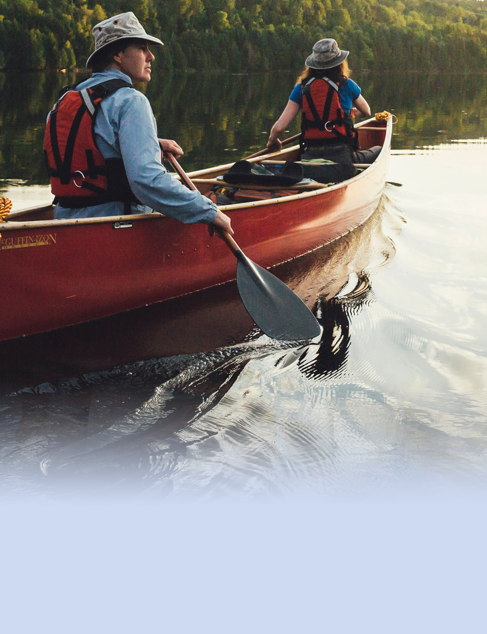Canoe Paddlers on calm lake